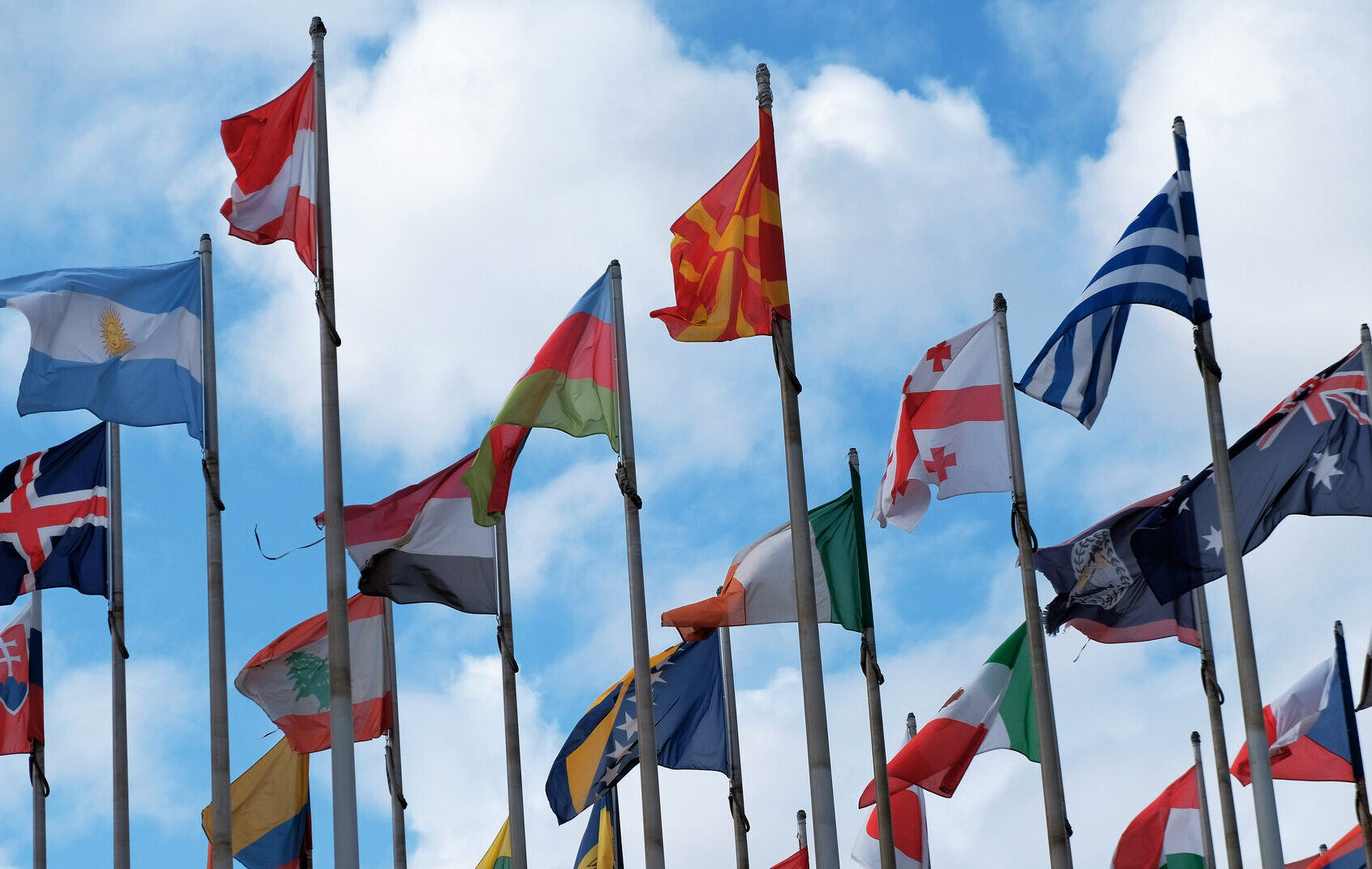 Flags from different countries around the world fluttering